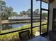 Relaxing screened patio boasts seating with tranquil pond and pool views at 4505 45Th W Ave # 101B, Bradenton, FL 34210