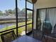 Relaxing screened patio boasts seating with tranquil pond and pool views at 4505 45Th W Ave # 101B, Bradenton, FL 34210