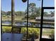 Relaxing screened patio boasts seating with tranquil pond and pool views at 4505 45Th W Ave # 101B, Bradenton, FL 34210