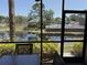 Relaxing screened patio boasts seating with tranquil pond and pool views at 4505 45Th W Ave # 101B, Bradenton, FL 34210