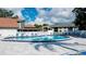Relaxing community pool area with plenty of lounge chairs, a pristine pool, and a comfortable atmosphere at 4505 45Th W Ave # 101B, Bradenton, FL 34210
