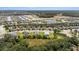 Aerial view reveals a community with well-spaced houses, accented by green spaces, ponds, and inviting roads at 4515 Roycroft Ter, Parrish, FL 34219