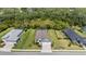 Aerial view of a well-maintained home with a manicured lawn and screened-in pool at 4515 Roycroft Ter, Parrish, FL 34219