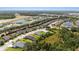 Expansive aerial shot displays a community with beautiful homes near meandering ponds and roads at 4515 Roycroft Ter, Parrish, FL 34219