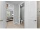 Bathroom showing an attached toilet area and doorway to a bedroom at 4515 Roycroft Ter, Parrish, FL 34219