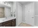 Bathroom featuring a modern vanity, shower with neutral tile, and linen closet at 4515 Roycroft Ter, Parrish, FL 34219