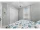 Bedroom featuring a comfortable bed, closet, and sheer curtains at 4515 Roycroft Ter, Parrish, FL 34219