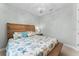 Bedroom featuring a comfortable bed with matching nightstand and a decorative chandelier at 4515 Roycroft Ter, Parrish, FL 34219
