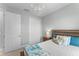 Comfortable bedroom features a chandelier, neutral walls, and a cozy bed with decorative pillows at 4515 Roycroft Ter, Parrish, FL 34219
