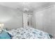Bedroom featuring a comfortable bed, closet, and view into a bathroom at 4515 Roycroft Ter, Parrish, FL 34219