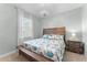 Cozy bedroom featuring a comfortable bed with matching nightstand and a decorative chandelier at 4515 Roycroft Ter, Parrish, FL 34219