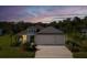 Beautiful exterior view of the home during dusk, featuring lush landscaping and a well-maintained lawn at 4515 Roycroft Ter, Parrish, FL 34219