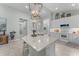 Gourmet kitchen features an island with seating and ample counter space for cooking at 4515 Roycroft Ter, Parrish, FL 34219