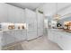 Contemporary kitchen with white cabinets, subway tile backsplash, stainless steel appliances, and an adjacent dining area at 4515 Roycroft Ter, Parrish, FL 34219