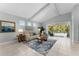 Comfortable living room with tile floors and sliding glass doors offering pool views at 4515 Roycroft Ter, Parrish, FL 34219