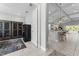 Bright, airy living room featuring tile floors, an open floor plan, and modern furnishings at 4515 Roycroft Ter, Parrish, FL 34219