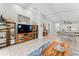 Bright living area with tile floors and seamless flow to kitchen and dining spaces at 4515 Roycroft Ter, Parrish, FL 34219