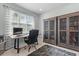 Well-lit office space includes a desk, chair, built-in bookcase, and natural light at 4515 Roycroft Ter, Parrish, FL 34219