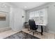 Office with a large window provides natural light and a view of the outdoors at 4515 Roycroft Ter, Parrish, FL 34219