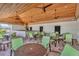 Relaxing outdoor seating area with a covered patio and a large grill and counter at 4515 Roycroft Ter, Parrish, FL 34219
