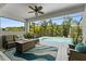 A screened in patio featuring seating and a swimming pool at 4515 Roycroft Ter, Parrish, FL 34219
