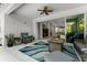 Covered patio with a ceiling fan, fire pit, and seamless indoor-outdoor flow through sliding glass doors at 4515 Roycroft Ter, Parrish, FL 34219