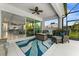 Covered patio with comfortable seating, a fire pit, and easy access to the home's interior at 4515 Roycroft Ter, Parrish, FL 34219