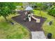 Community playground with slides, swings, and benches, offering a safe and fun play area for with a nice backdrop at 4515 Roycroft Ter, Parrish, FL 34219