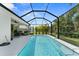 Screened-in pool featuring bright blue water, and a seating area under the covered patio at 4515 Roycroft Ter, Parrish, FL 34219
