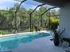 Screened in pool with lush greenery in the backyard at 4515 Roycroft Ter, Parrish, FL 34219