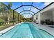 A gorgeous pool and patio area with screened enclosure, providing a serene outdoor experience at 4515 Roycroft Ter, Parrish, FL 34219
