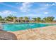 Community swimming pool with ample chairs for lounging and a covered seating area at 4515 Roycroft Ter, Parrish, FL 34219
