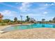Large community swimming pool with a slide and ample deck space for residents to enjoy at 4515 Roycroft Ter, Parrish, FL 34219