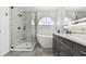 The bathroom has a walk-in shower, soaking tub, and modern fixtures at 4604 9Th E Ave, Bradenton, FL 34208