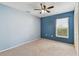 Bedroom featuring neutral carpet, modern ceiling fan, and a window with blinds at 4604 9Th E Ave, Bradenton, FL 34208