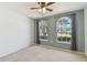 Bright bedroom with arched windows and soft, neutral carpeting at 4604 9Th E Ave, Bradenton, FL 34208