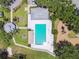 Aerial shot of the community pool area, showcasing a pool, playground, and well-maintained landscaping at 4604 9Th E Ave, Bradenton, FL 34208
