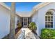 Inviting entrance with landscaped walkway, arched window and a clear view of the screened front door at 4604 9Th E Ave, Bradenton, FL 34208