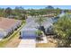 Charming home with a 2-car garage and well-kept lawn is set against a scenic waterfront backdrop at 4604 9Th E Ave, Bradenton, FL 34208