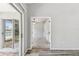 The entry hallway has wood floors and leads to another bedroom at 4604 9Th E Ave, Bradenton, FL 34208