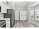 This kitchen has stainless steel appliances and lots of white cabinet storage at 4604 9Th E Ave, Bradenton, FL 34208