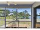 Screened in patio with a view of the pond and landscaped backyard at 4604 9Th E Ave, Bradenton, FL 34208