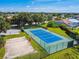 Community tennis and sand volleyball courts are surrounded by well-maintained landscaping and green space at 4604 9Th E Ave, Bradenton, FL 34208