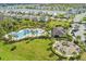 Community boasts an aerial view of a pool, playground, and well-manicured landscaping at 4722 Lindever Ln, Palmetto, FL 34221