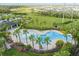 Large community pool features ample lounge areas, palm trees, and beautifully landscaped surroundings at 4722 Lindever Ln, Palmetto, FL 34221