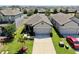 An aerial view of a single-Gathering home that showcases a well-maintained front yard and a private driveway at 4722 Lindever Ln, Palmetto, FL 34221