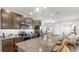 Modern kitchen features granite countertops, stainless steel appliances, and an island with bar seating at 4722 Lindever Ln, Palmetto, FL 34221