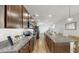 Bright kitchen showcasing stainless steel appliances, granite countertops, and a spacious island with bar seating at 4722 Lindever Ln, Palmetto, FL 34221