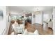 Open concept living room and kitchen with stainless steel appliances and breakfast bar at 4722 Lindever Ln, Palmetto, FL 34221