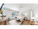 Cozy bedroom featuring wooden floors, ceiling fan, natural light, and minimalist decor at 4722 Lindever Ln, Palmetto, FL 34221